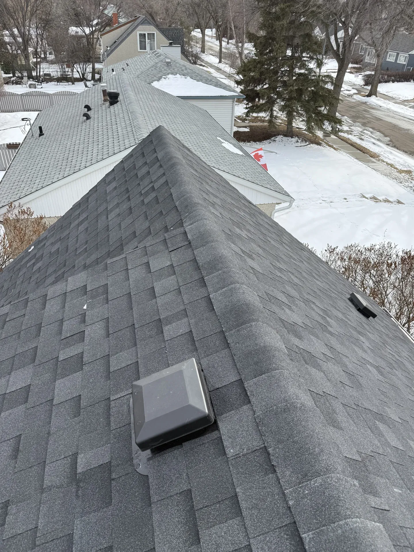 Completed asphalt-shingle roof installed by Royal Roofing