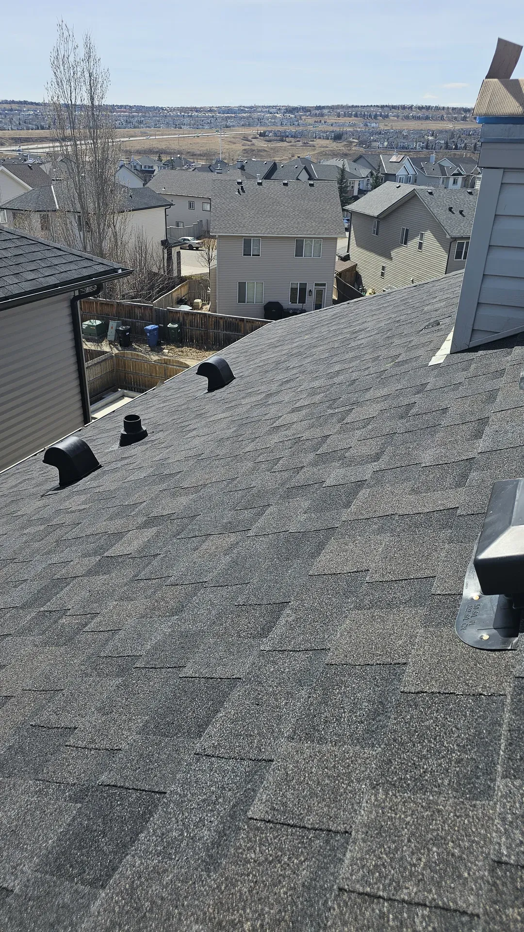Royal Roofing Edmonton crew finishing a residential roof replacement