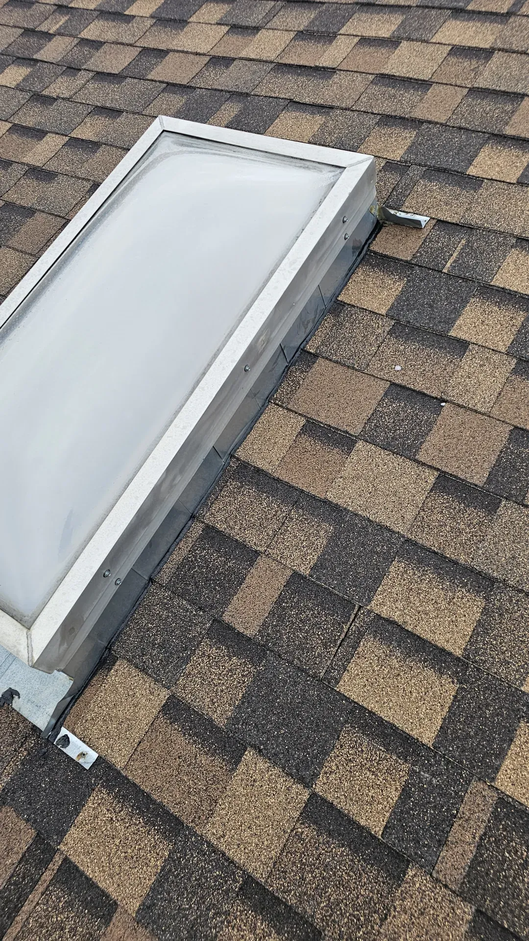 Skylight flashing detail on a completed Edmonton roof
