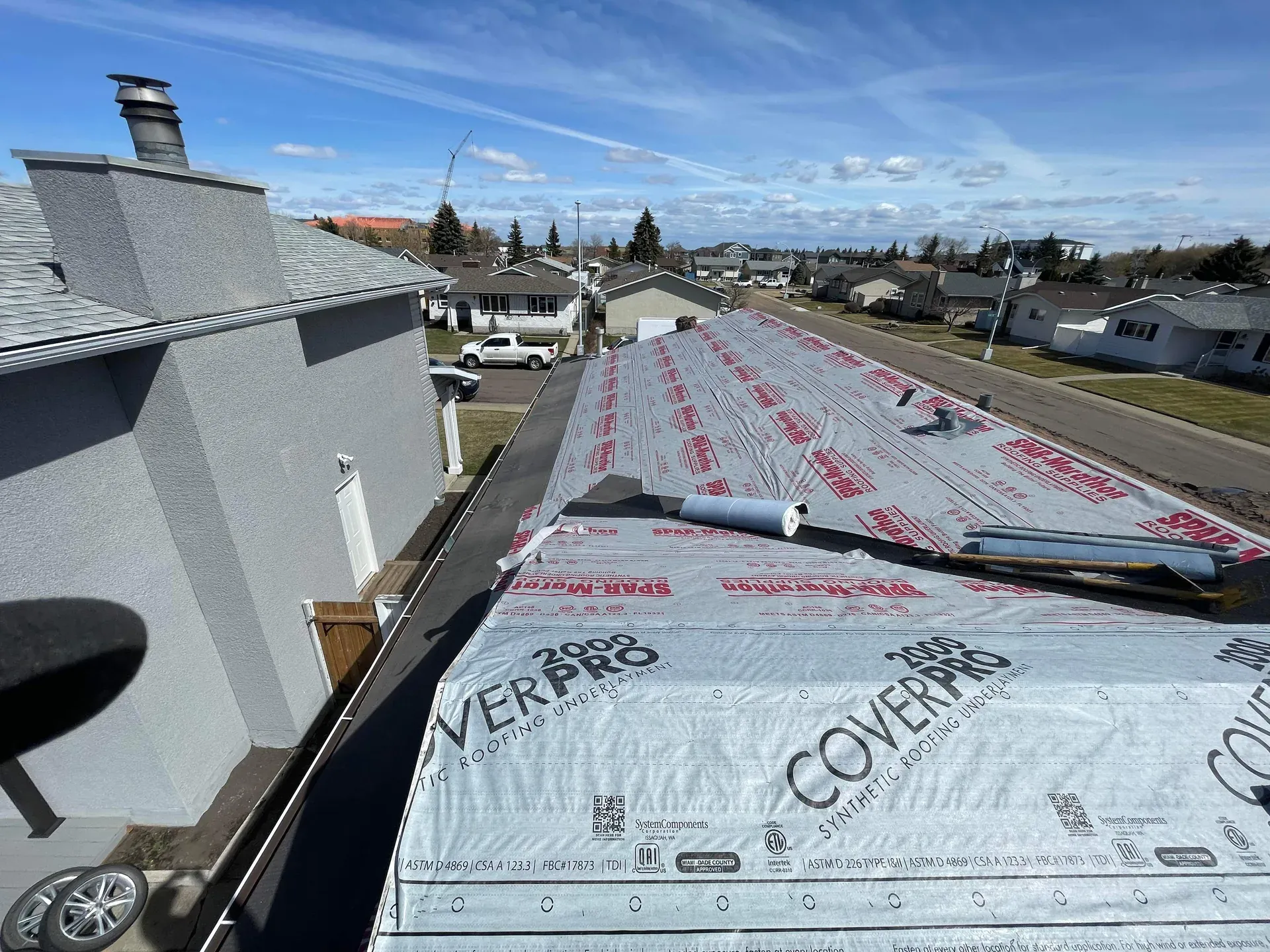 Cover Pro 2000 synthetic underlayment fully laid across an Edmonton roof before shingling begins