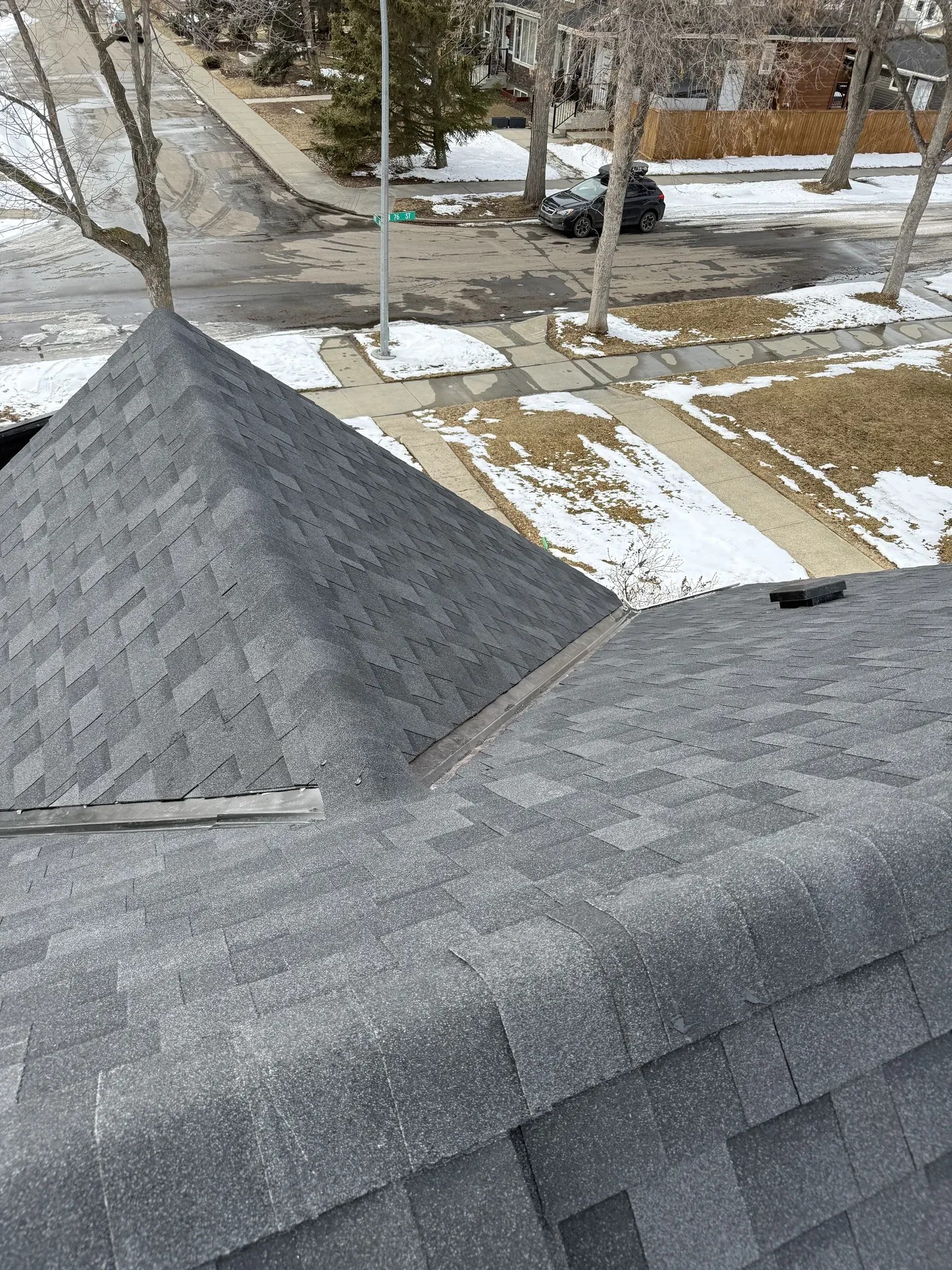 Winter close-up of a shingle hip and valley